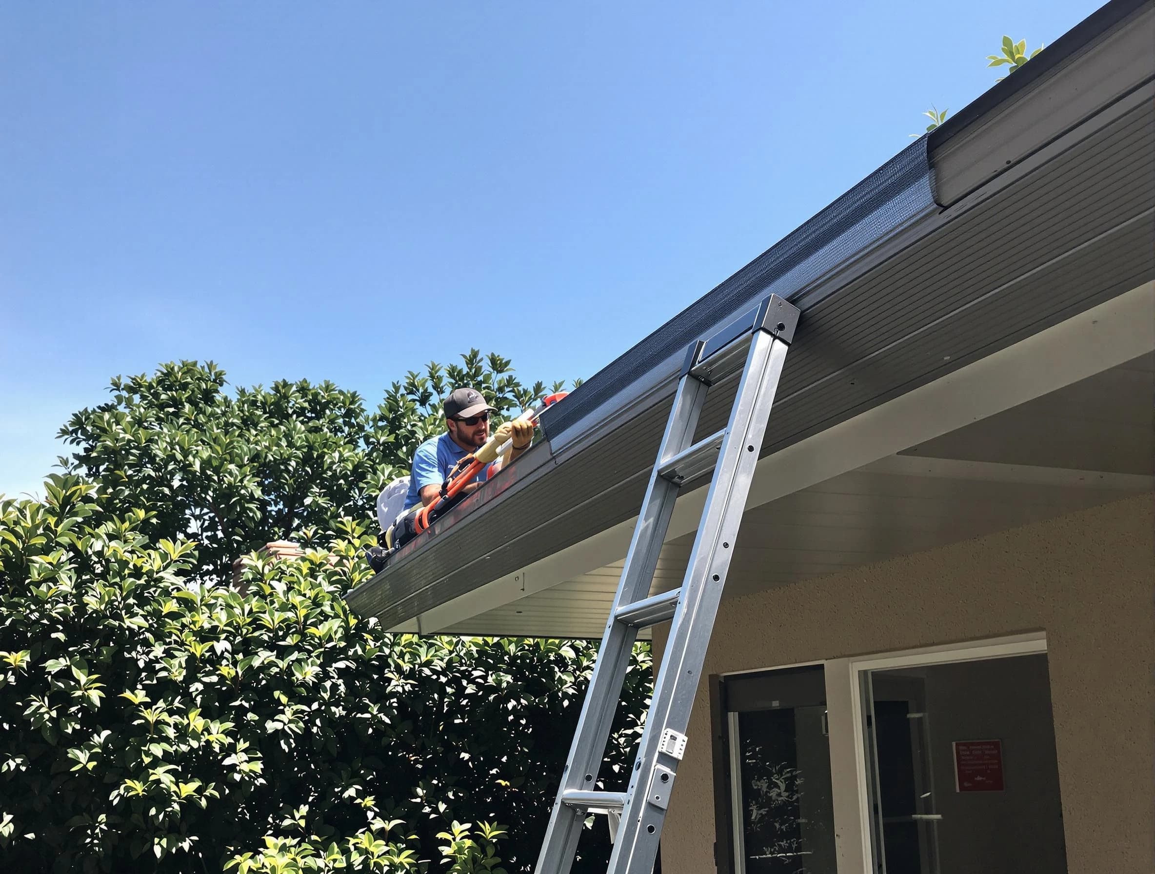 Hudson Roofing Company installing gutter guards for a homeowner in Hudson, OH