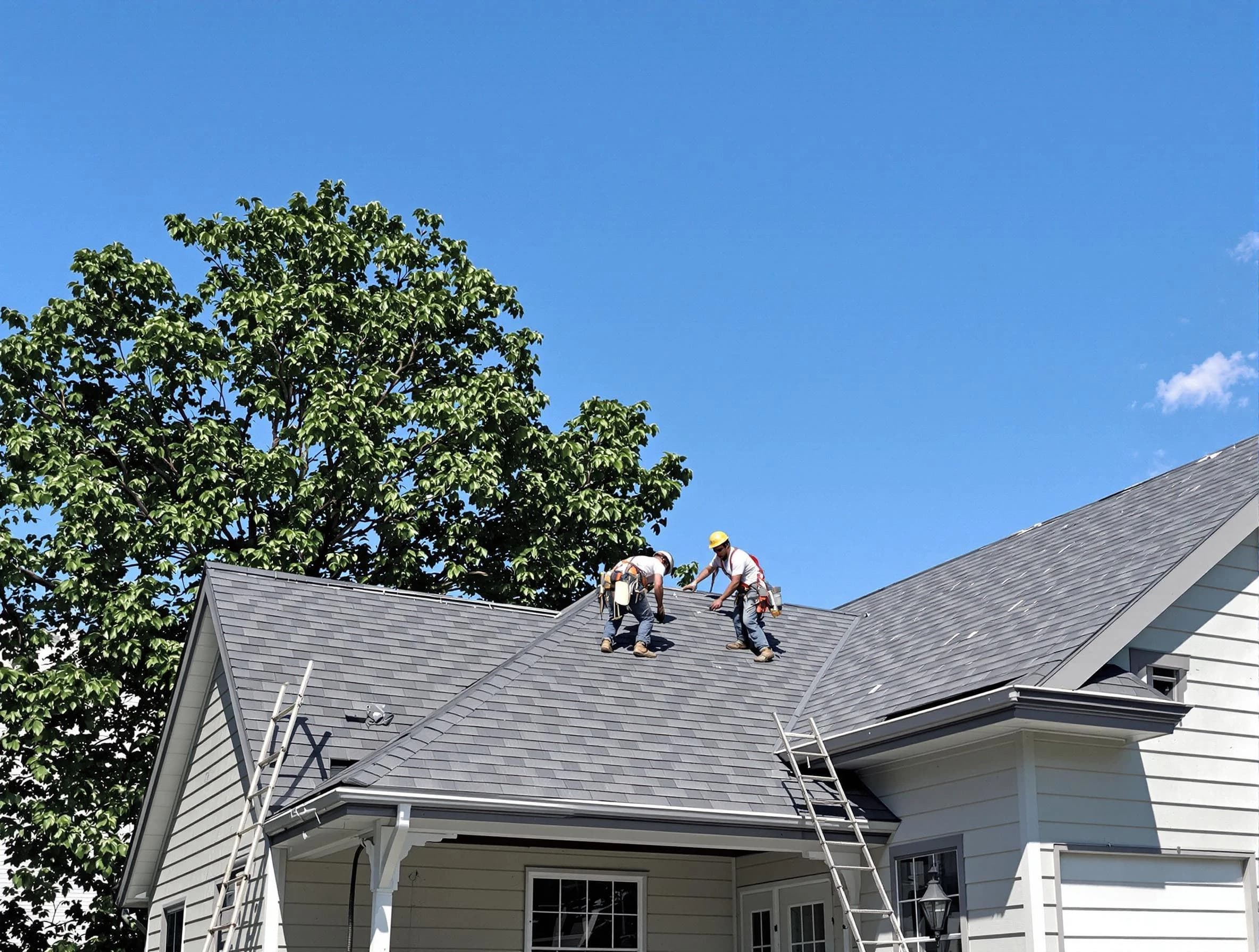 Hudson Roofing Company crew finalizing a roof installation in Hudson, OH